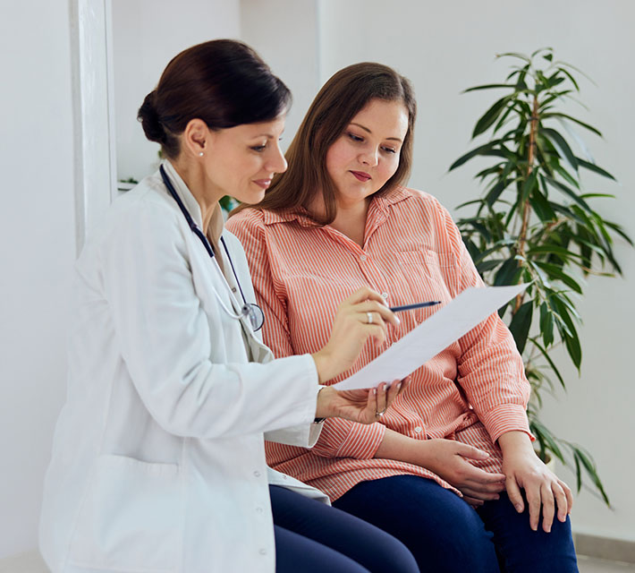 Doctor going over weight loss program with patient